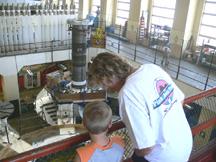 Kyle and Diana in Bonneville Dam Power House watching workers